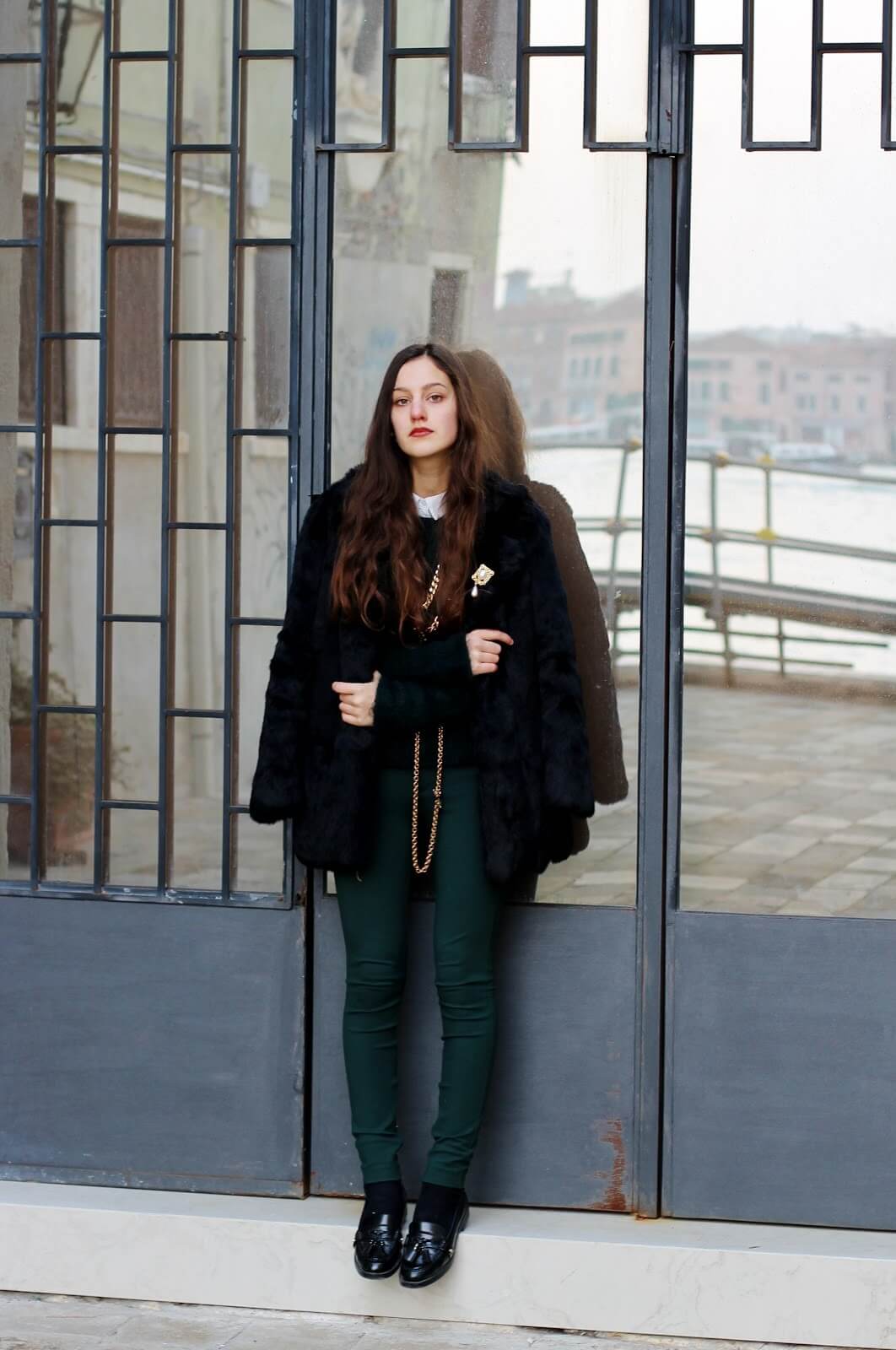 a girl with Dark green pants